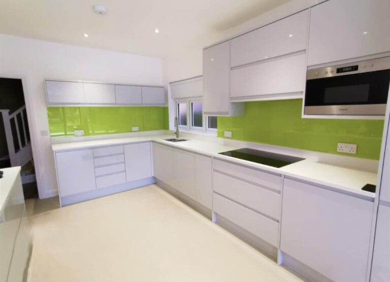 Light green glass kitchen splashback on 2 walls